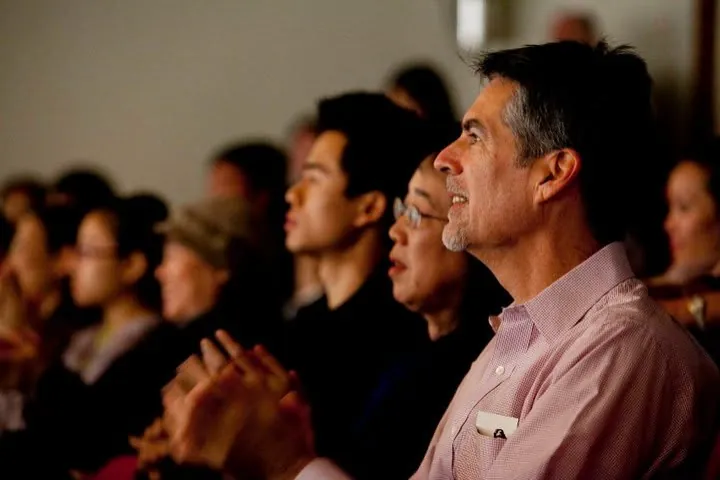 An audience watches a performance
