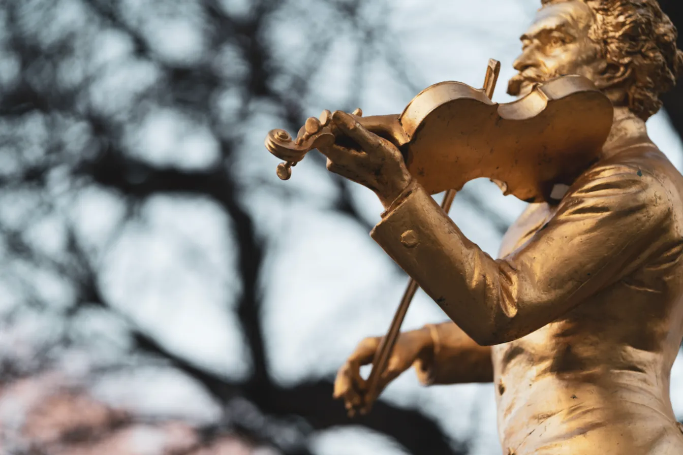 A golden statue of a violinist